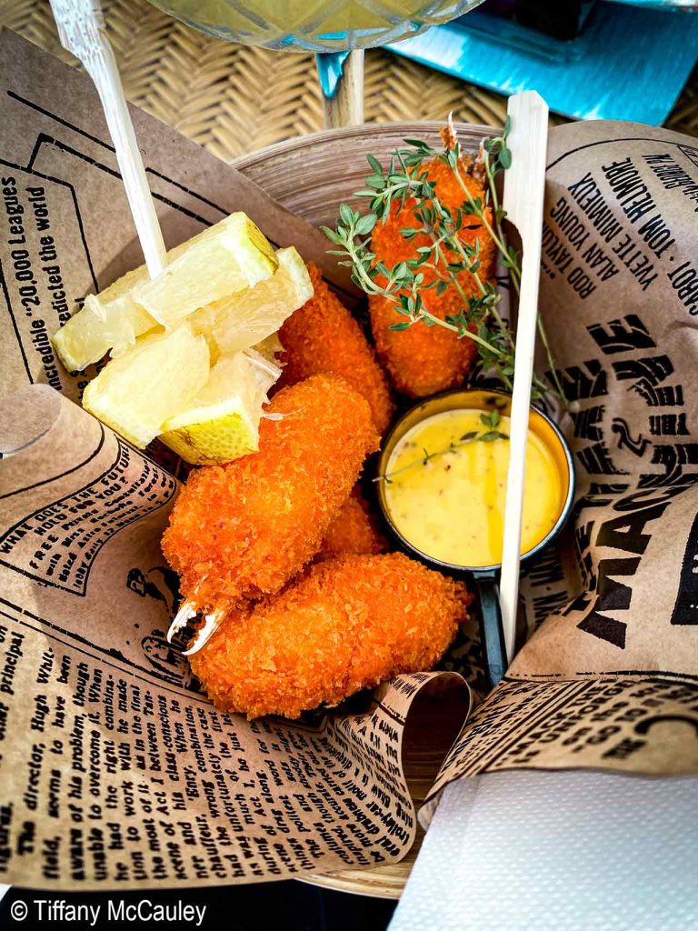 Seafood corquettas in a basket in Villa Joyosa, Spain.